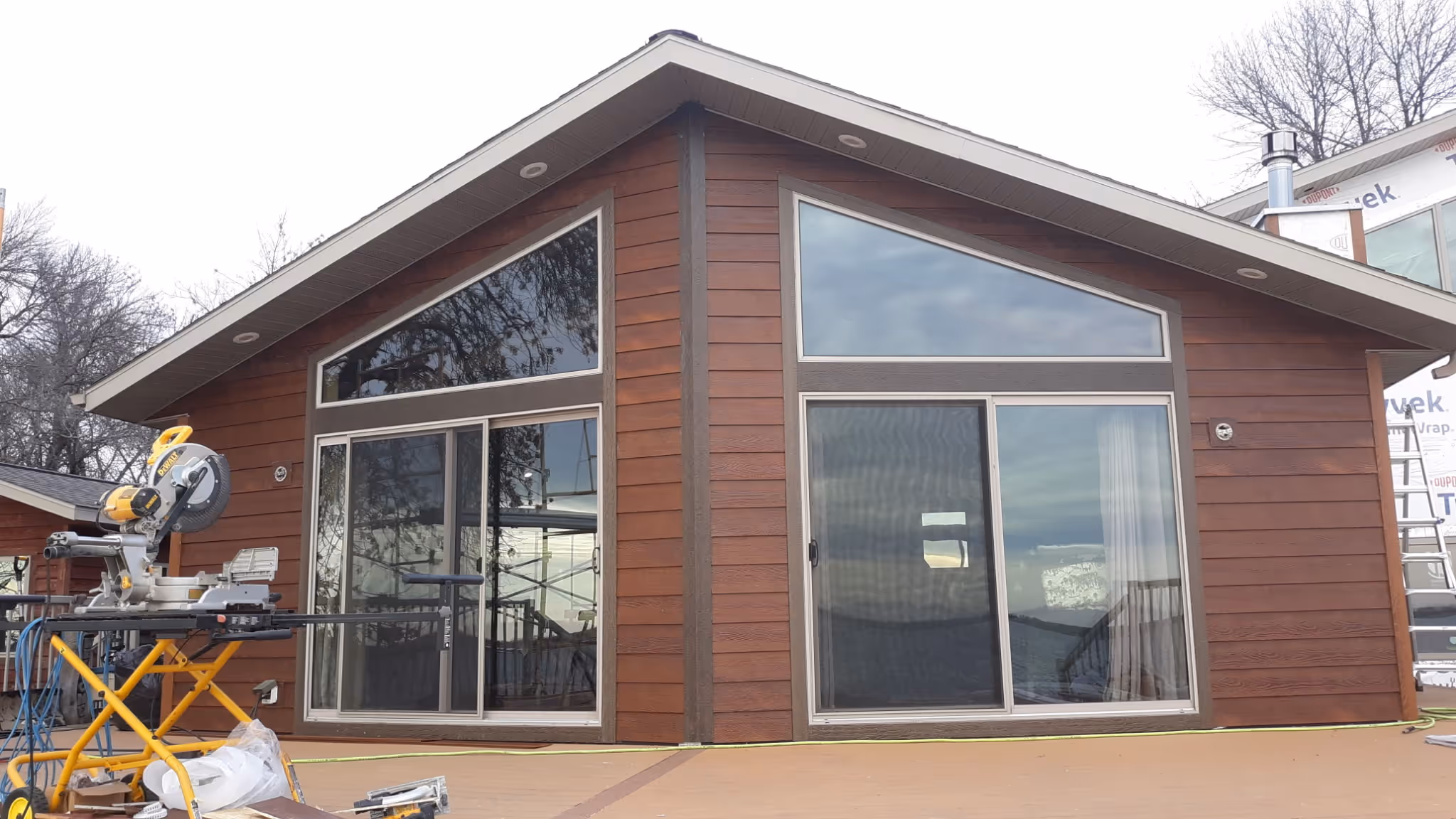 A small yard featuring a quaint house surrounded by a well-maintained lawn.