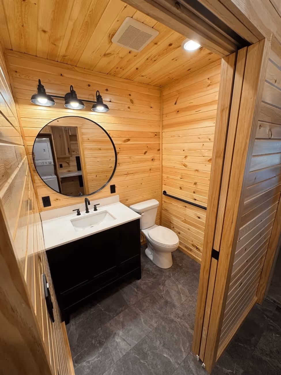 A small yard featuring a quaint house surrounded by a well-maintained lawn.