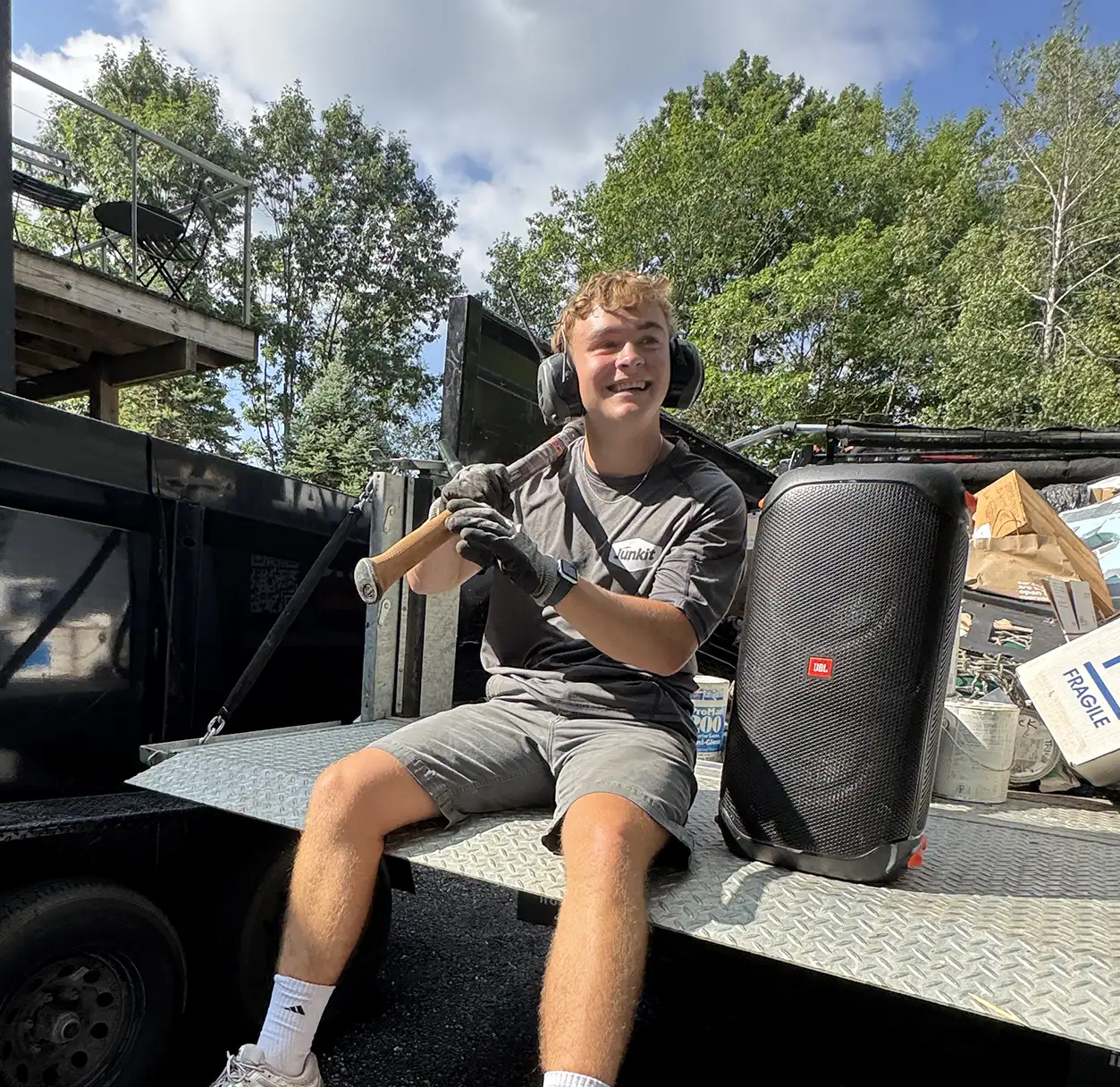 Junkit team member Danny preparing tools on-site for a junk removal job