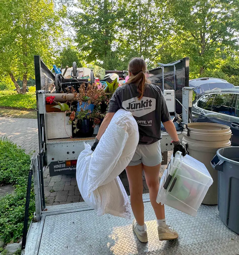 Junkit team member Ruby removing garage items for junk removal in Charlotte