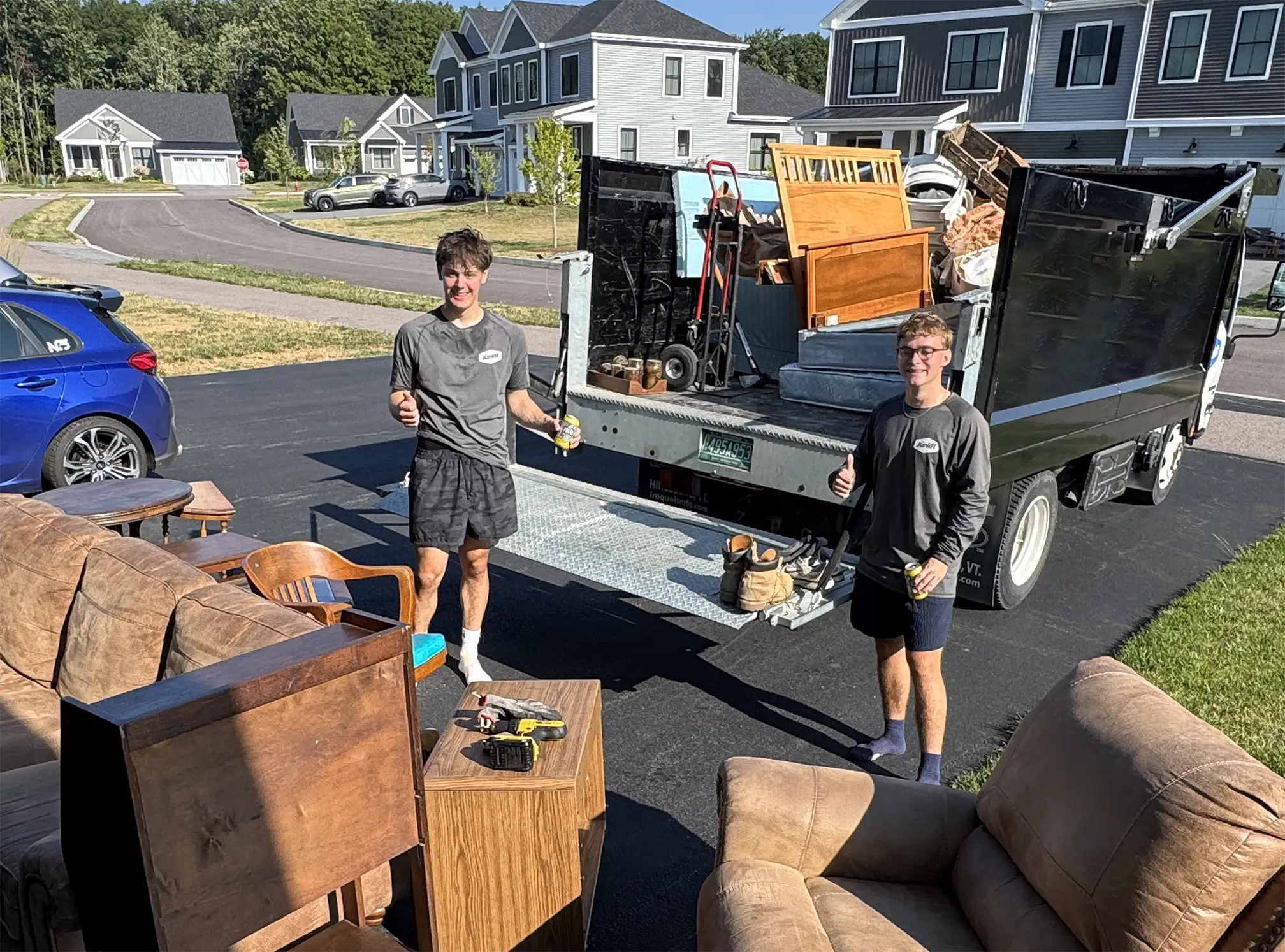 Junkit team removing furniture during estate cleanout service in Chittenden County Vermont