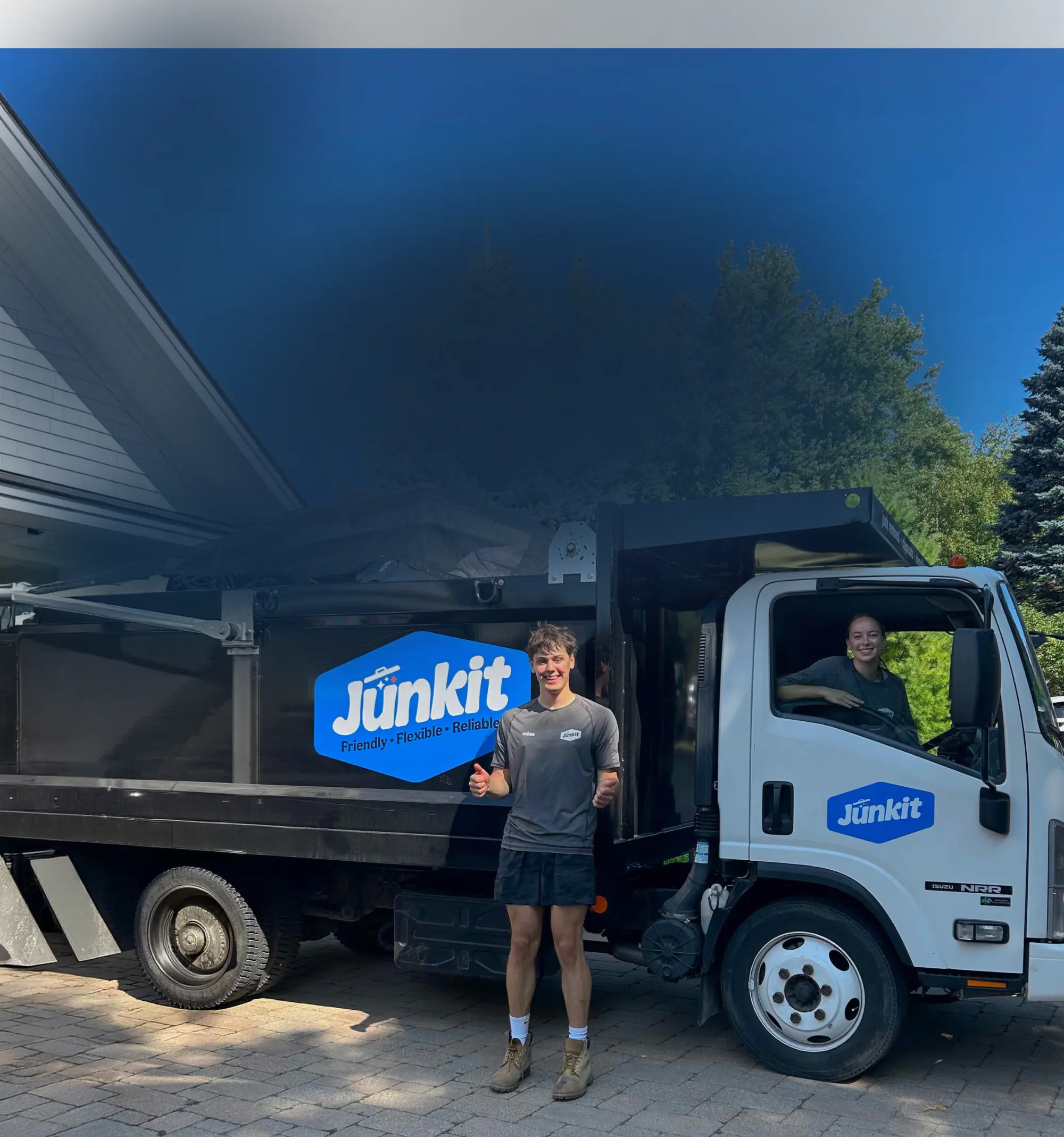 Junkit truck parked at a home in Charlotte Vermont during local junk removal service