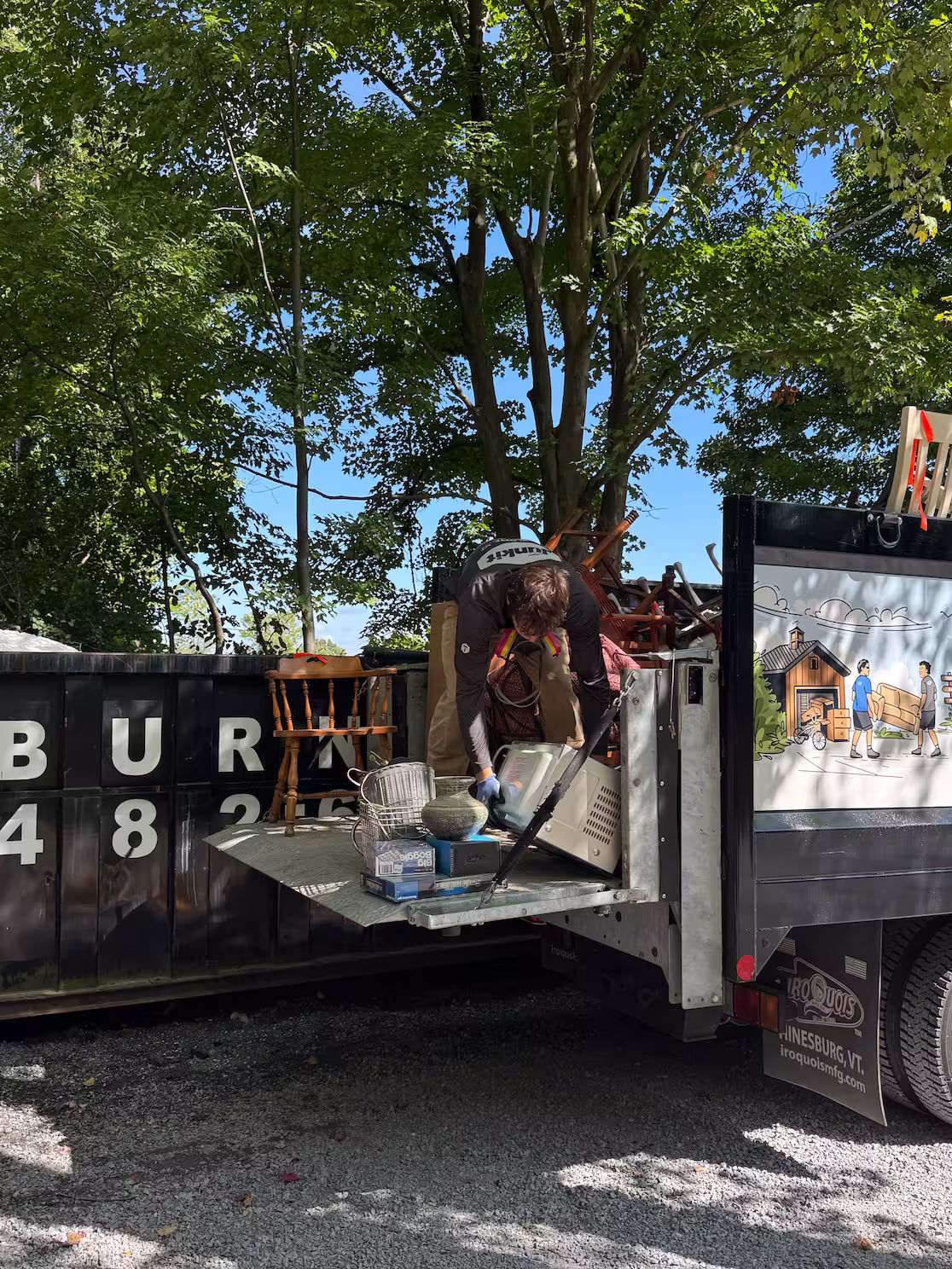 Junkit truck parked outside a home during a pickup