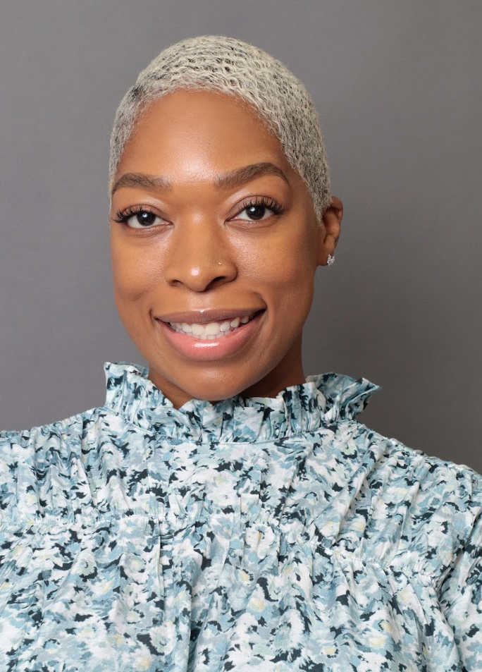 Alicia Watkins smiling in a professional headshot portrait