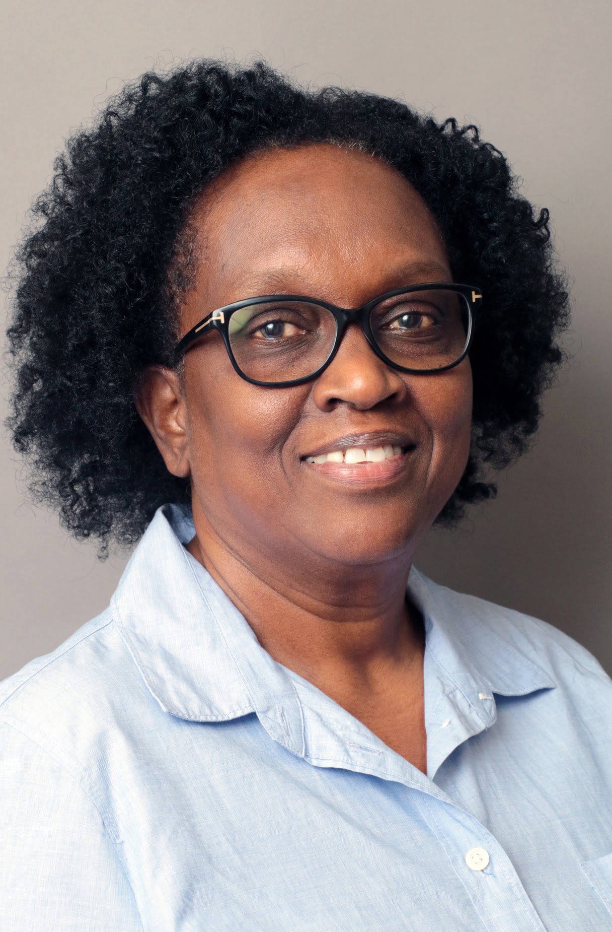 Corrine Mattis smiling in professional headshot portrait