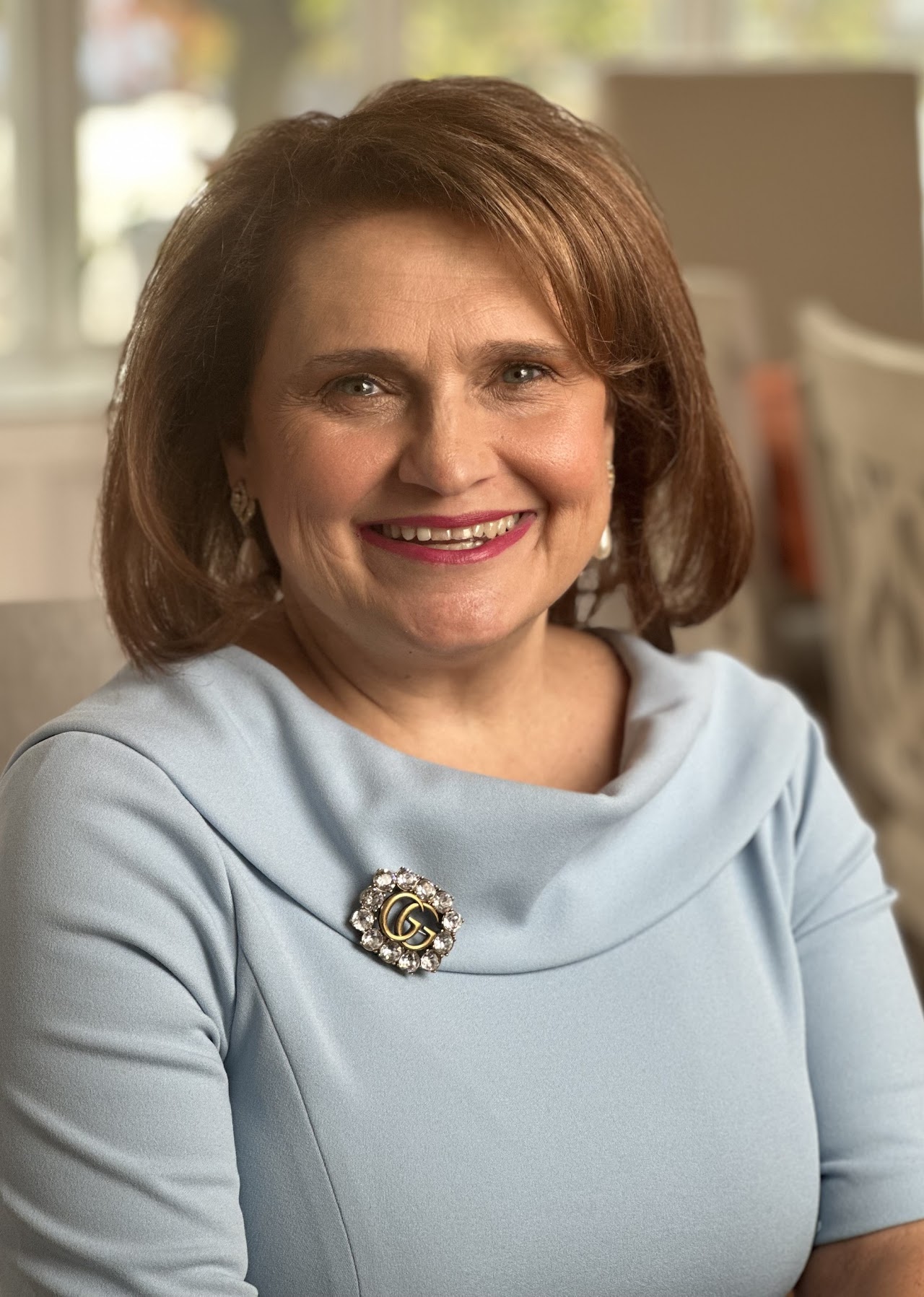 Janice Ross smiling in professional headshot portrait