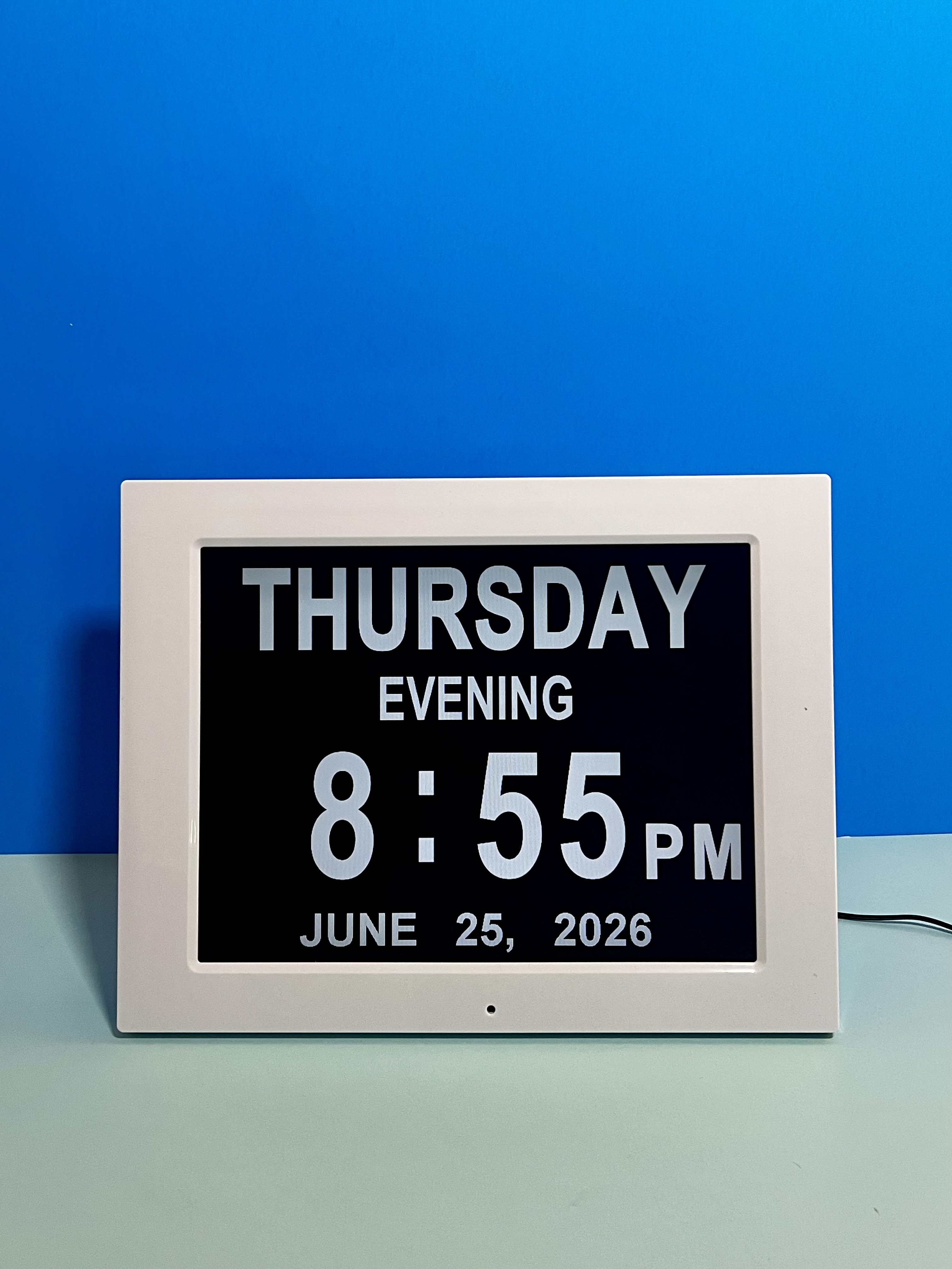 Digital clock displaying Thursday evening 8:55 PM, June 25, 2026 in white on black screen.