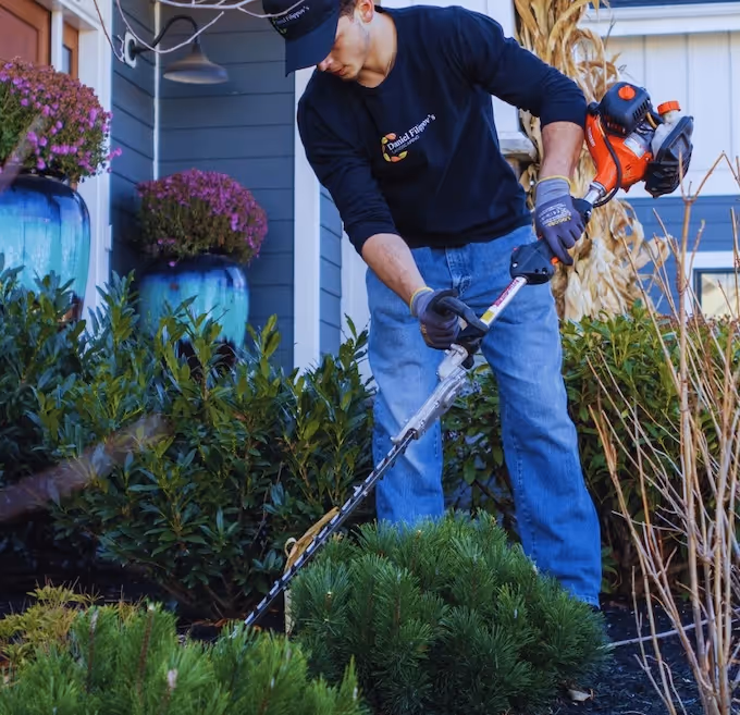 Landscaping professional working on a residential property.