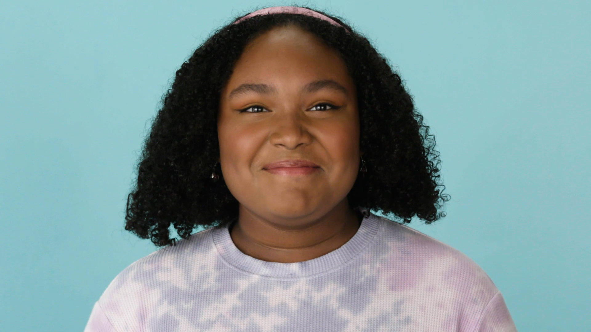 A young California Child Nutrition Act advocate against a teal background