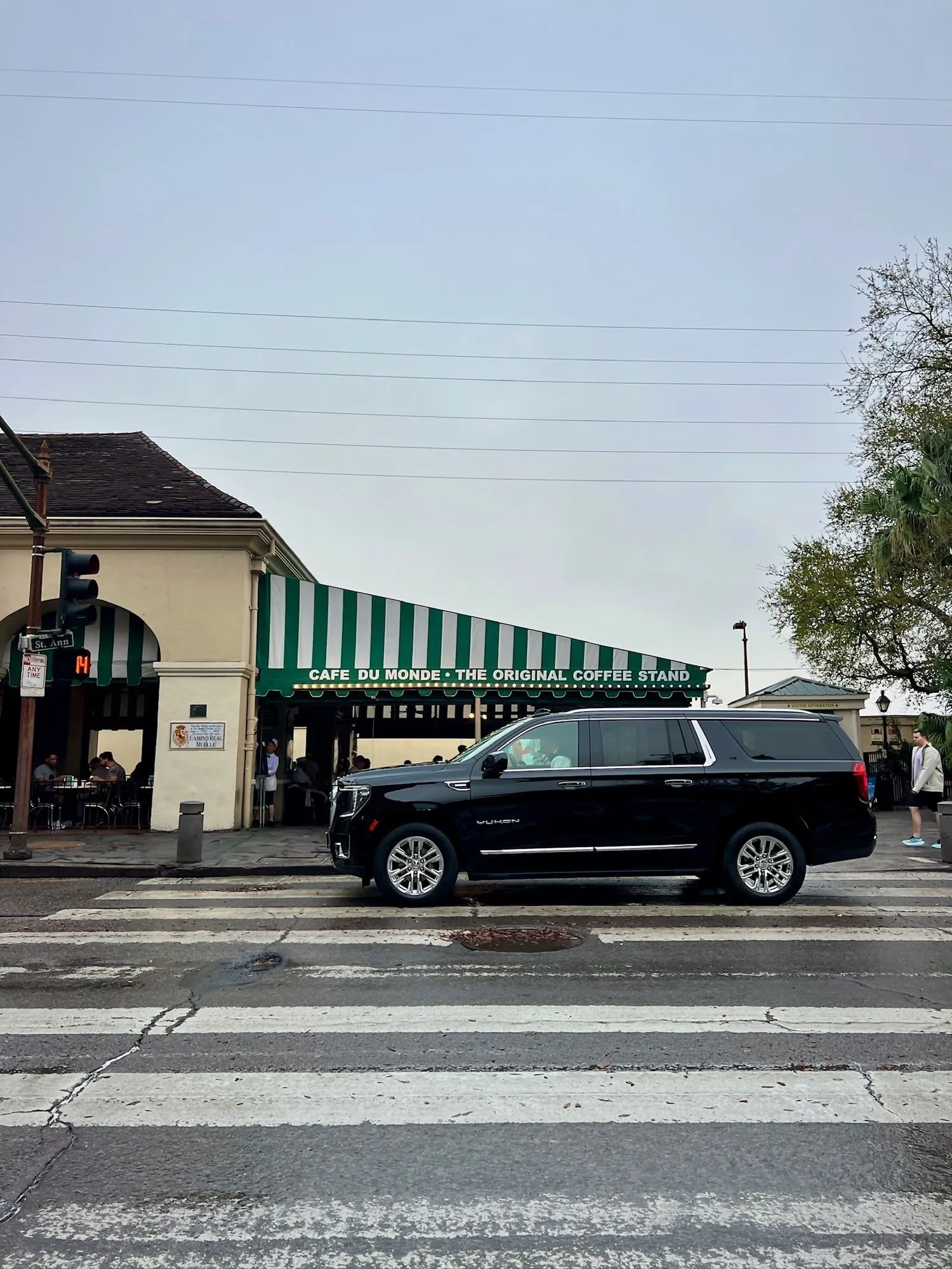 Black car service SUV outside Cafe Du Monde in the French Quarter, New Orleans