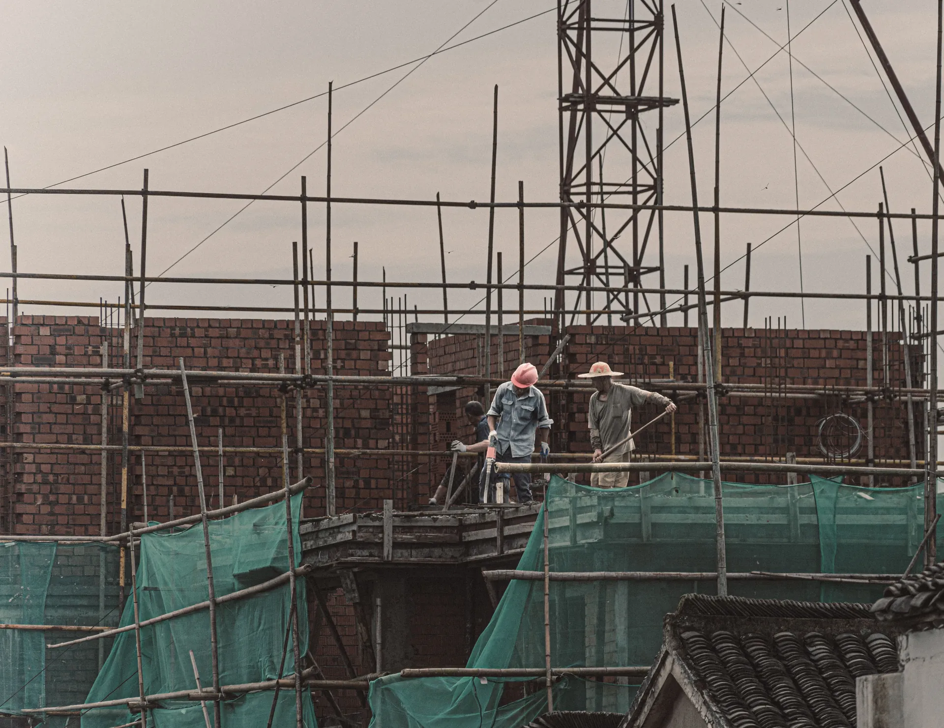 Construction workers on scaffolding