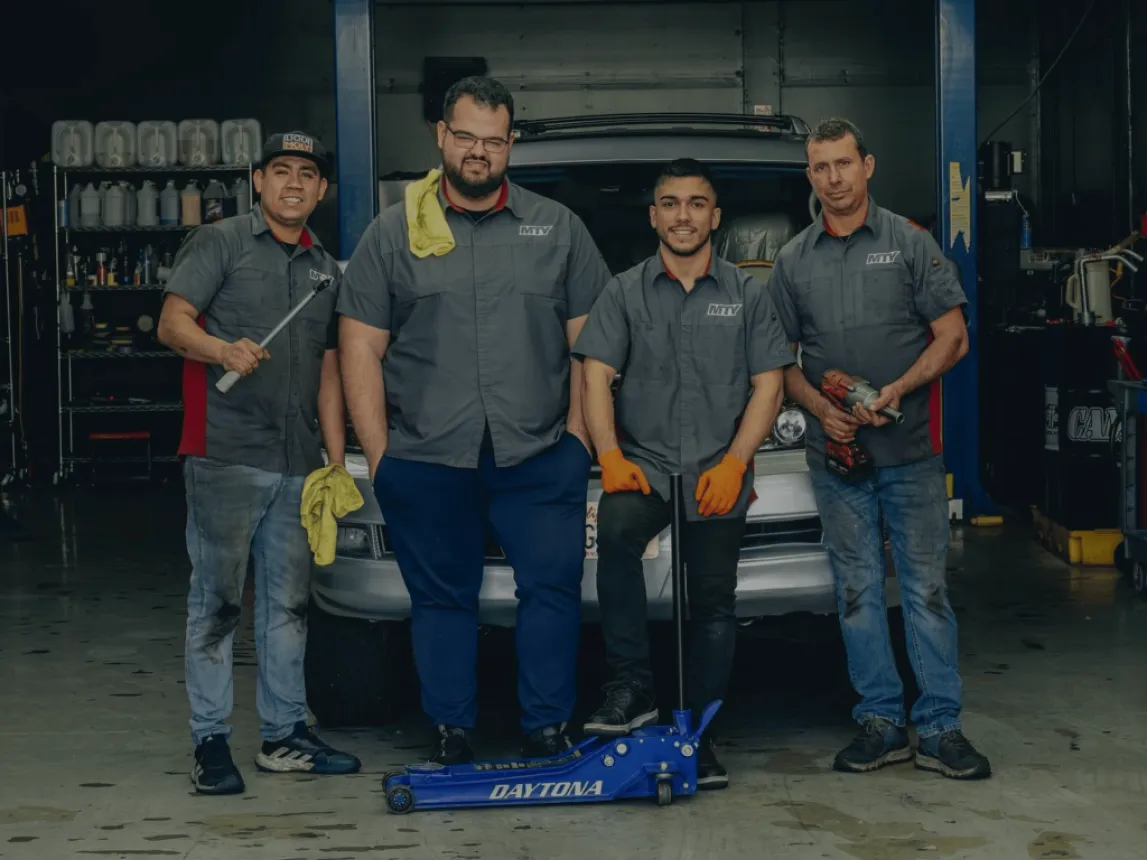 MTY Collision team members at their auto body shop