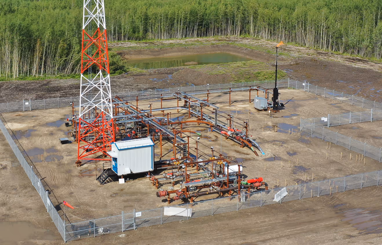 A remote industrial site featuring pipelines and other infrastructure.