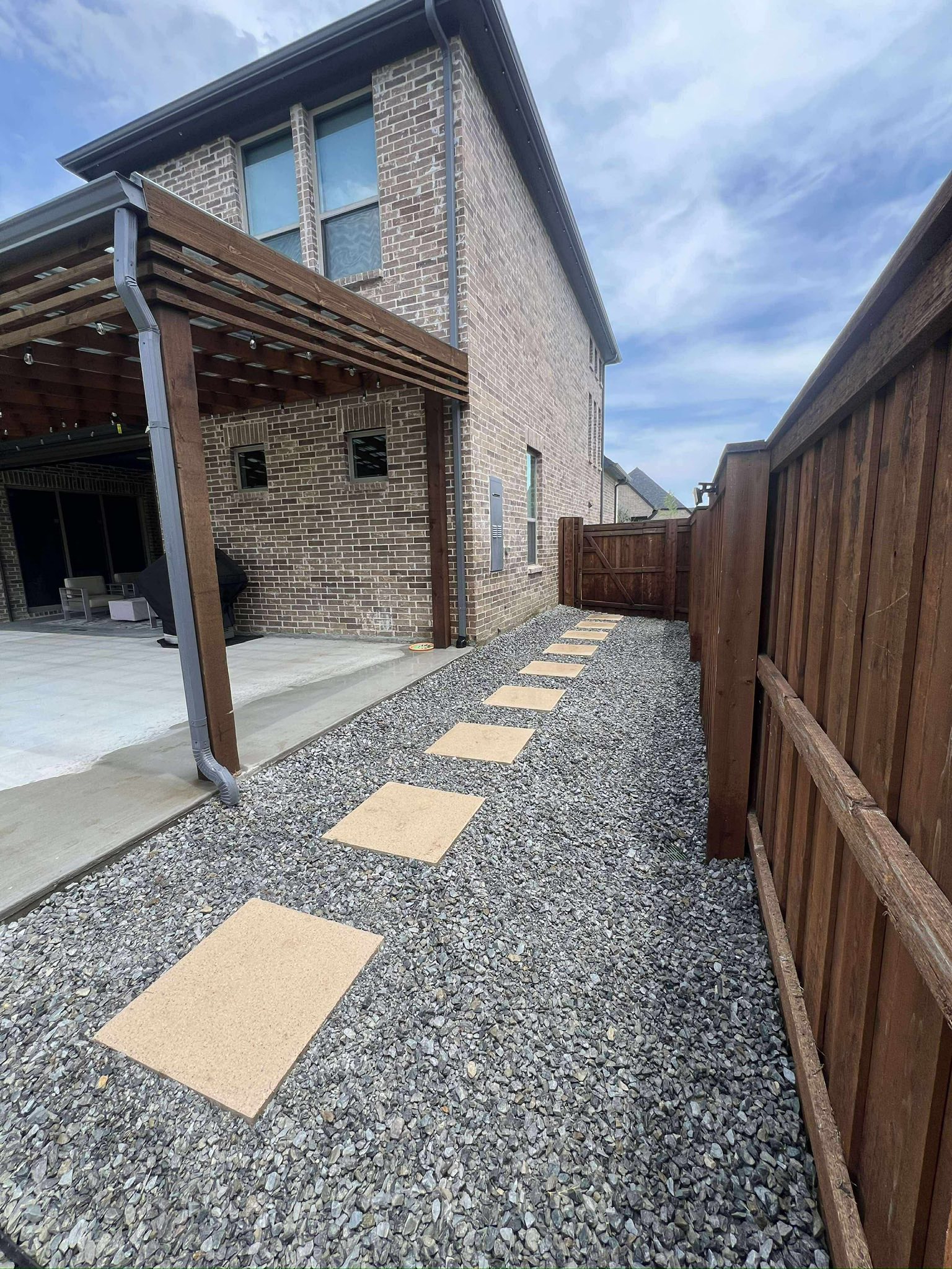 Paver patio with seating area installed in McKinney TX backyard