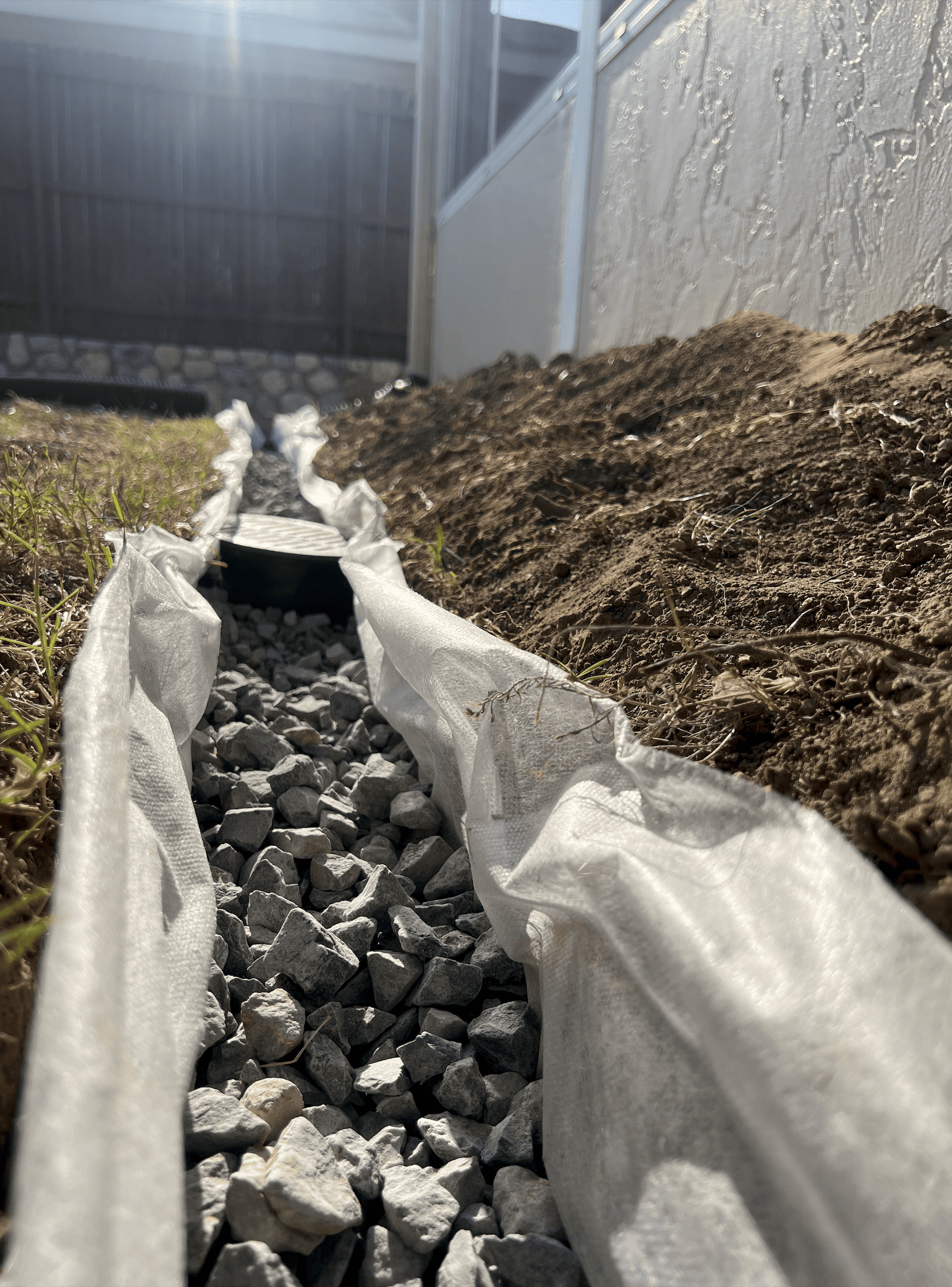 French drain trench installation in McKinney TX yard