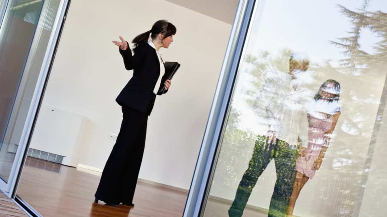 Real estate agent with customers
