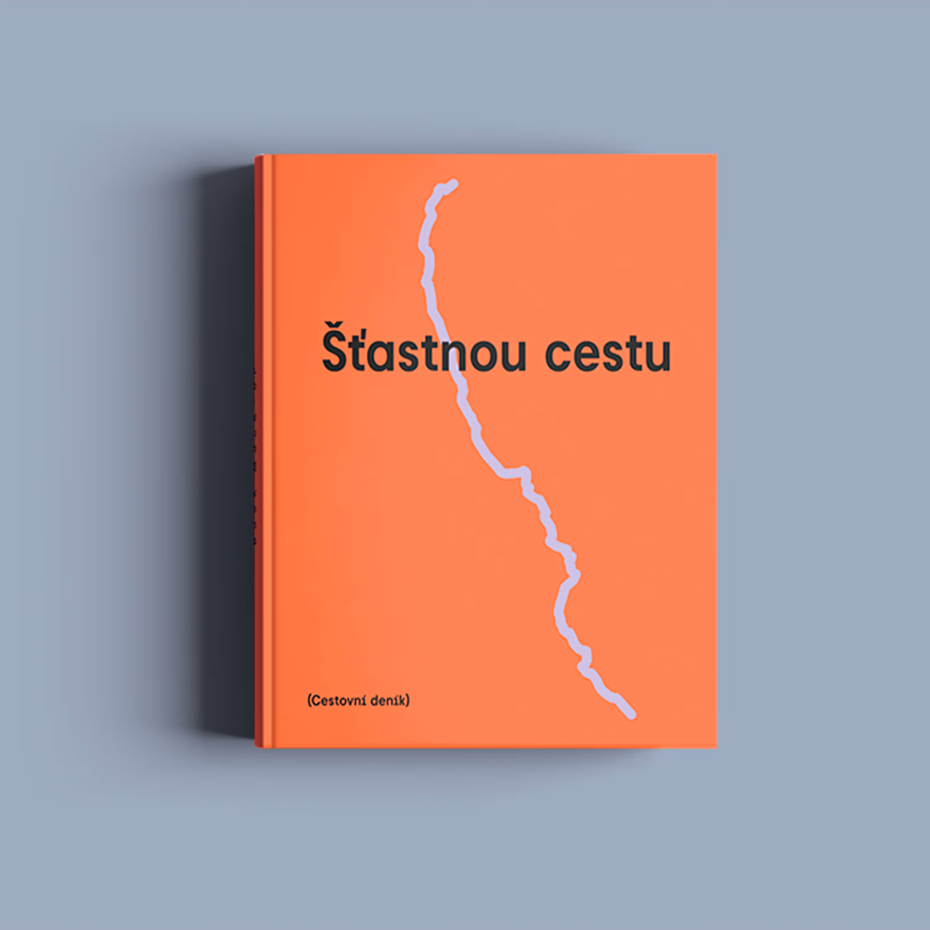 Oranžová kniha s nápisem Šťastnou cestu a fialovou křivkou na obálce.