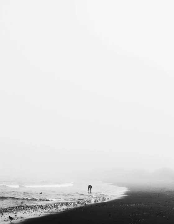 Minimalist white hillside under a bright, empty sky.