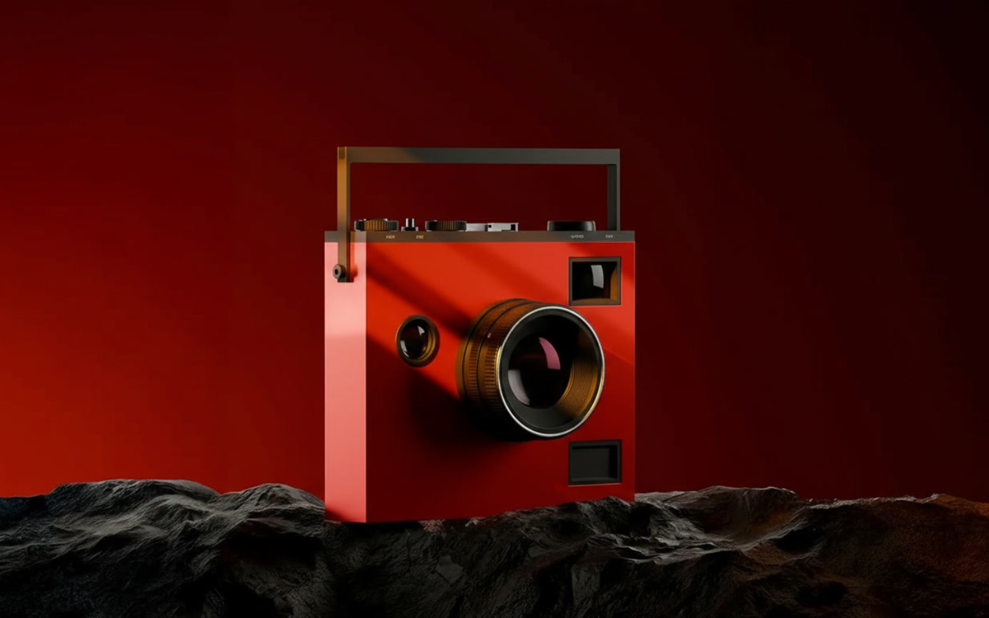 Red portable speaker with two large black circular speakers, placed on a rocky dark surface against a deep red background.
