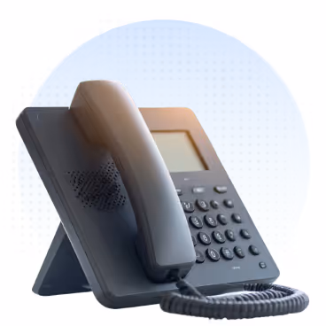 Black VoIP desk phone with a keypad and coiled cord on a blue dotted background.