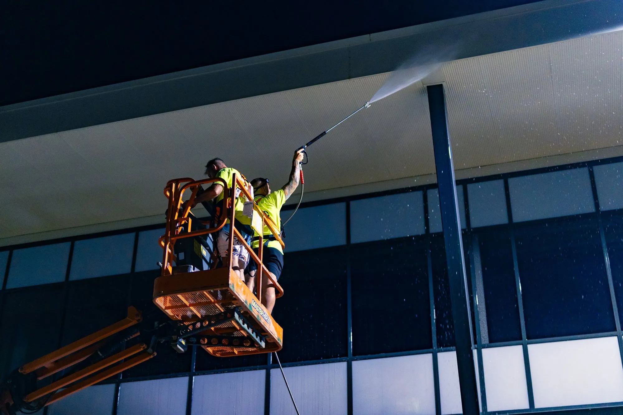 High-pressure window cleaning service on commercial building by Hosed Building and Gutter in Toowoomba