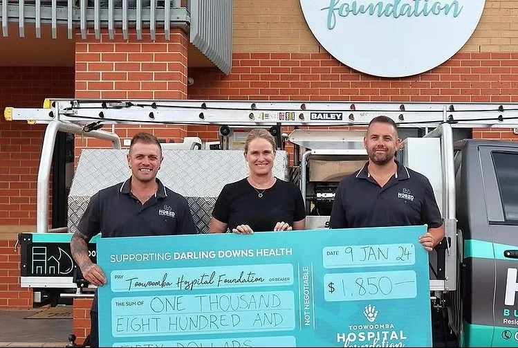 Hosed Building and Gutter team presenting donation to Toowoomba Hospital Foundation in support of local community healthcare