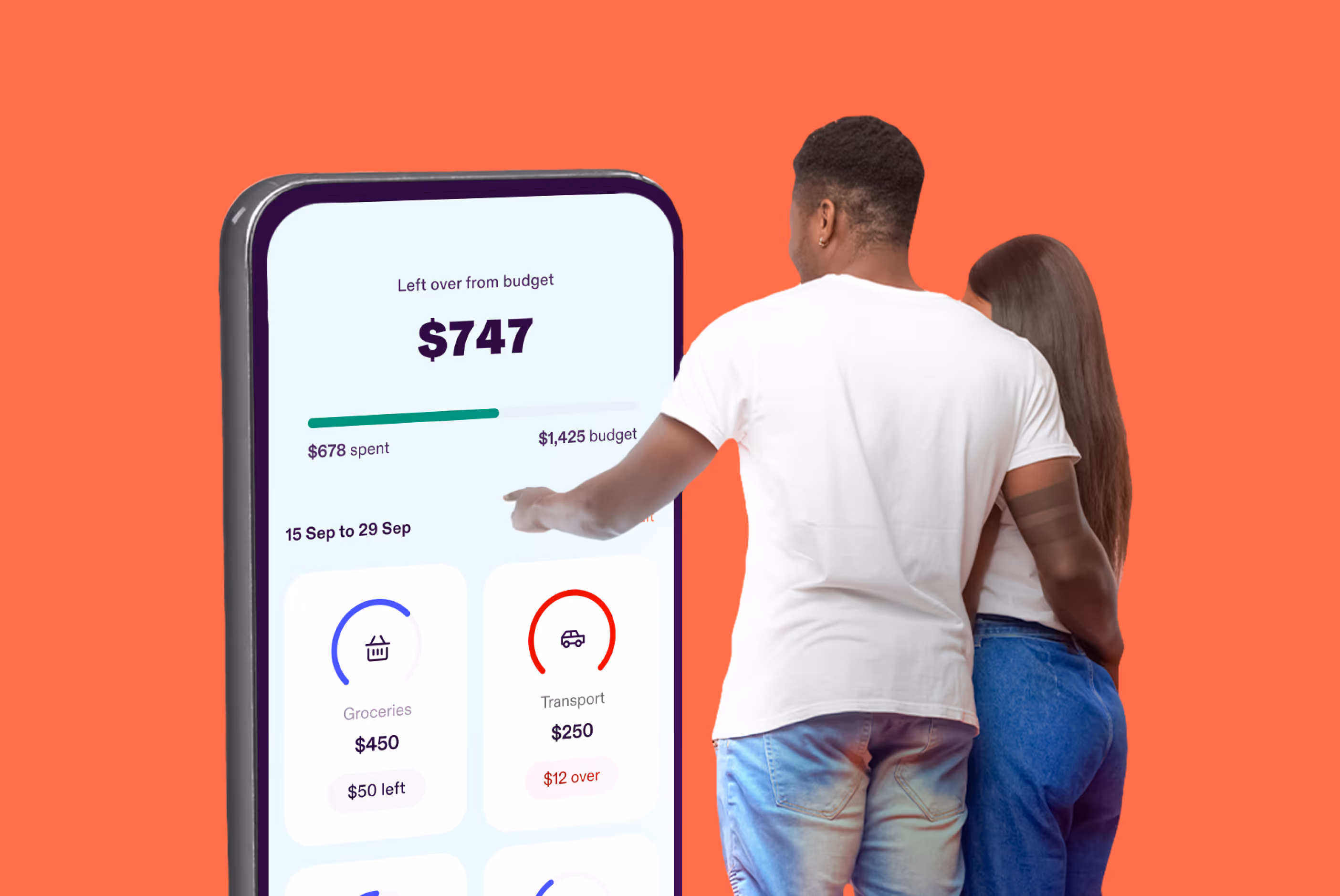 Couple looking to a big phone screen