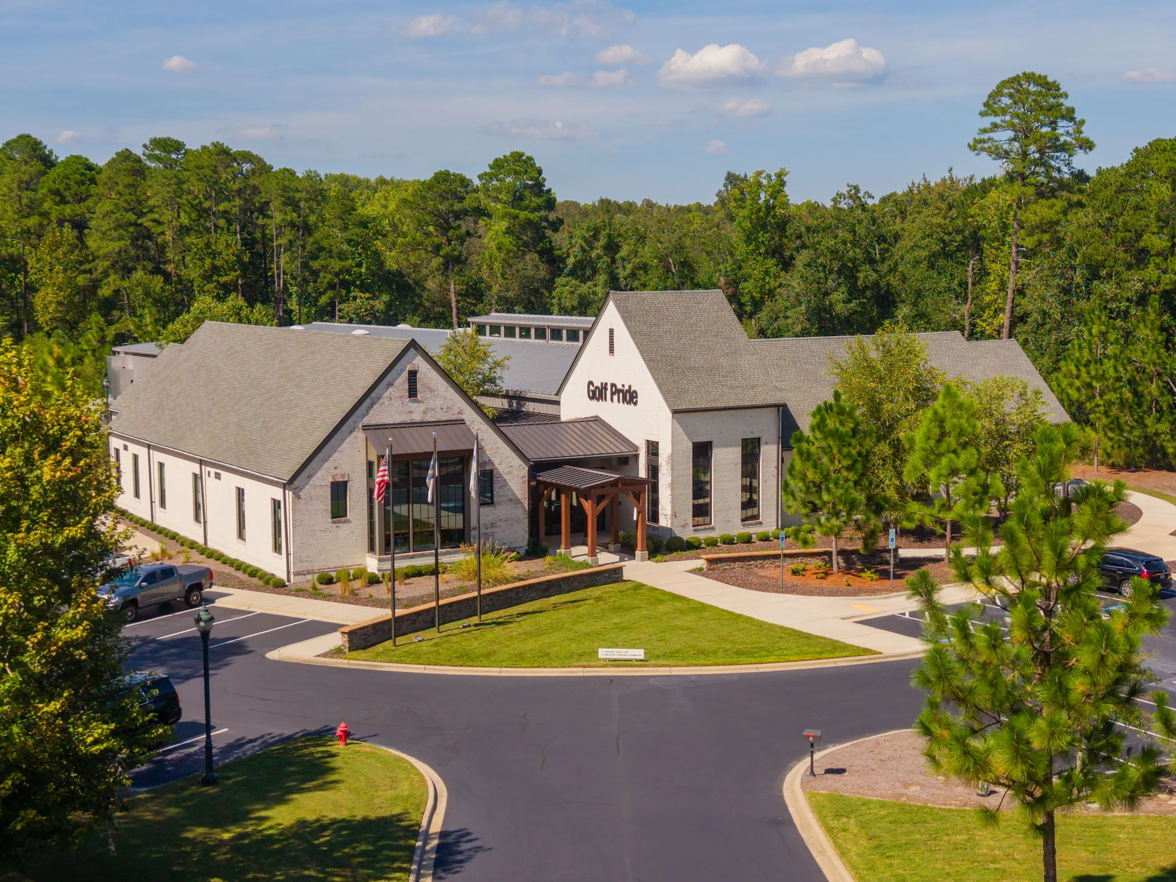 Aerial view of the Golf Pride commercial building and its surrounding site