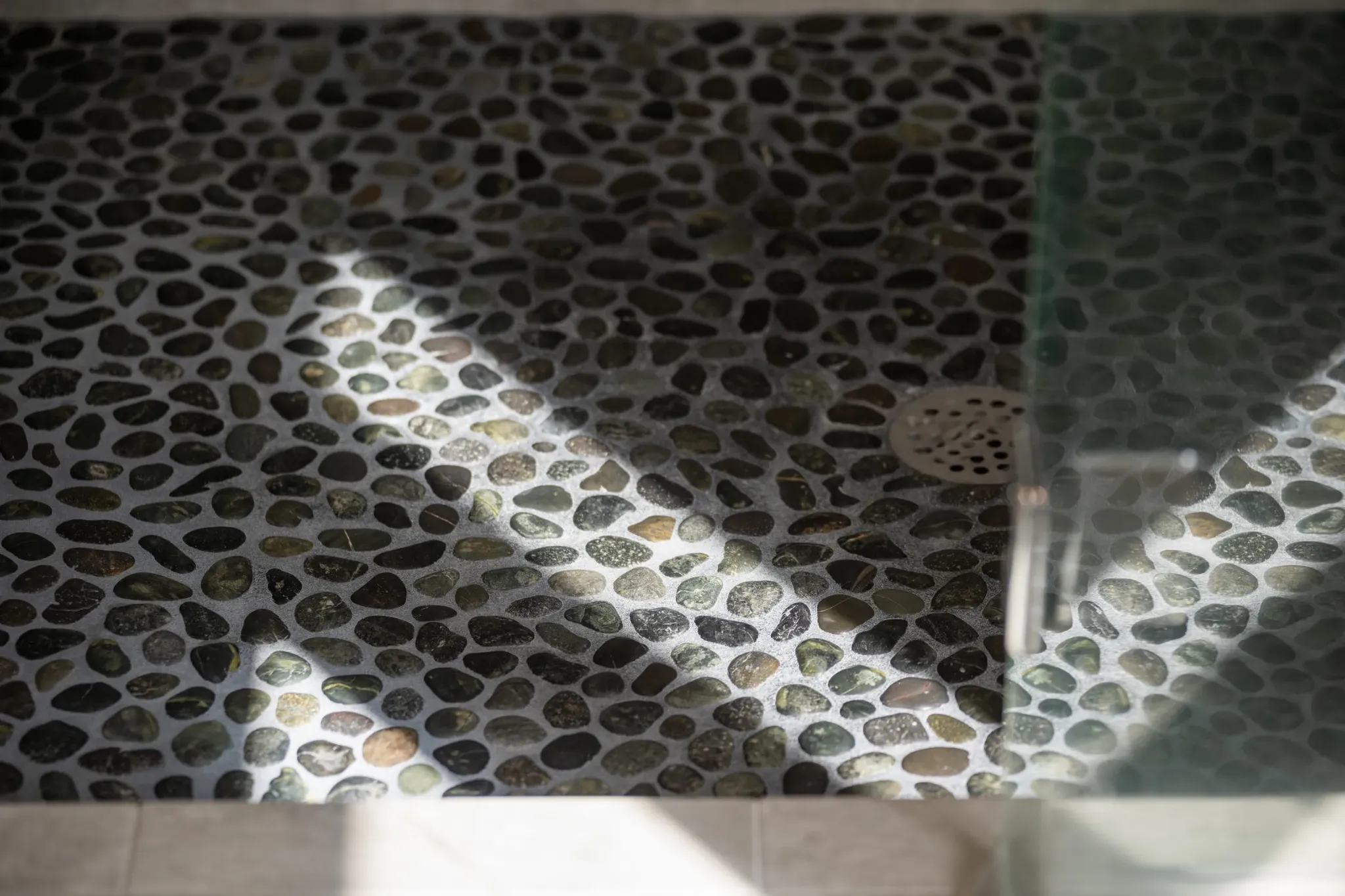 Natural pebble stone shower floor