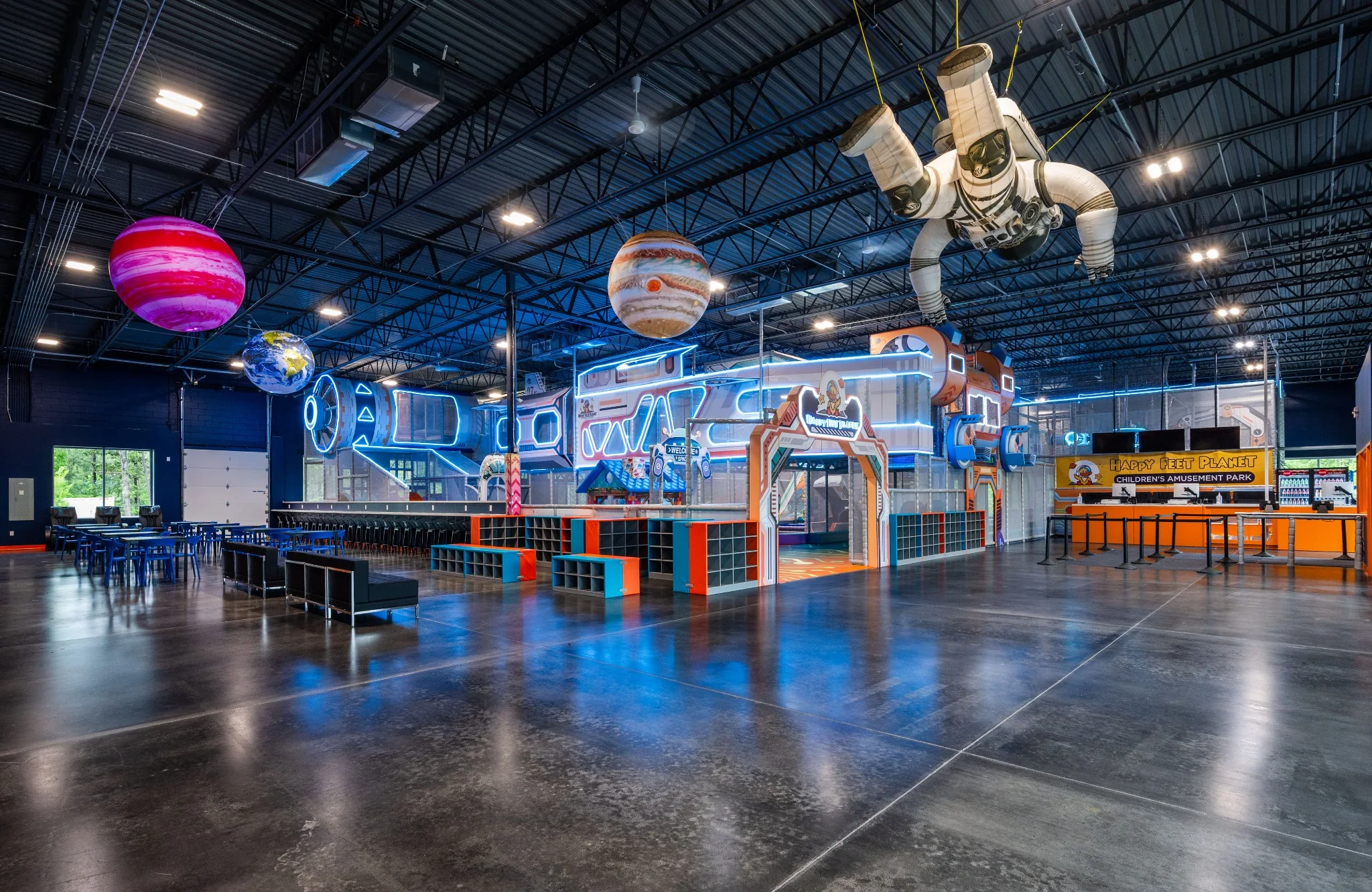 Happy Feet Planet indoor play facility and colorful branded environment