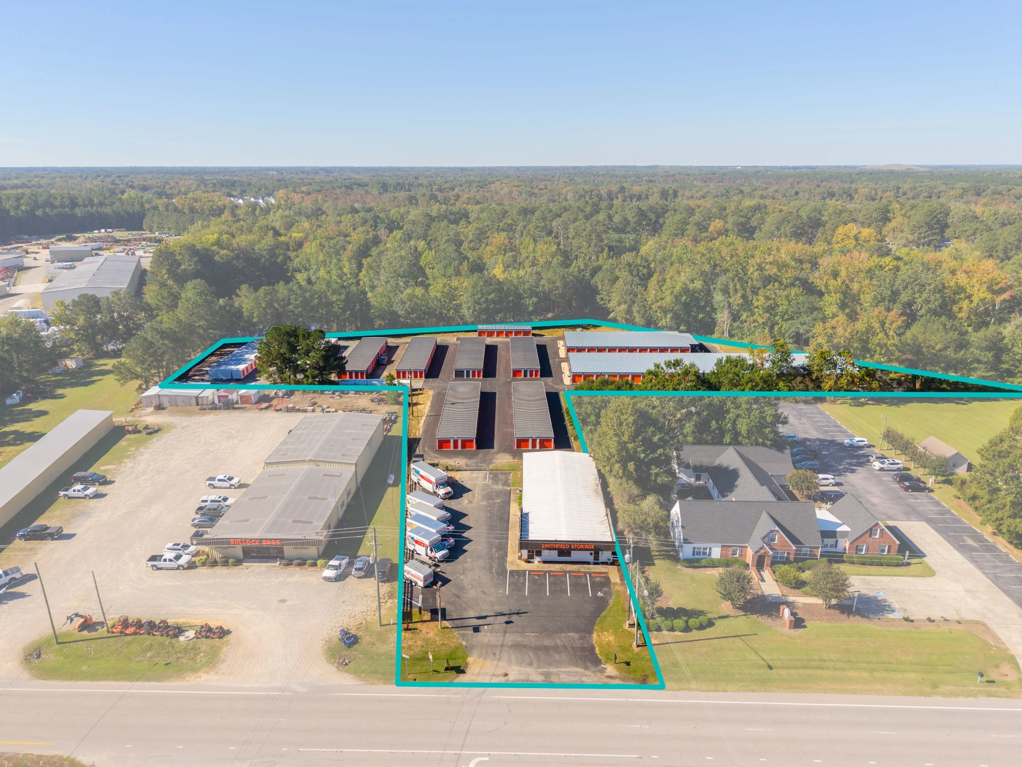 Aerial view of the full storage facility with a cyan property-boundary overlay