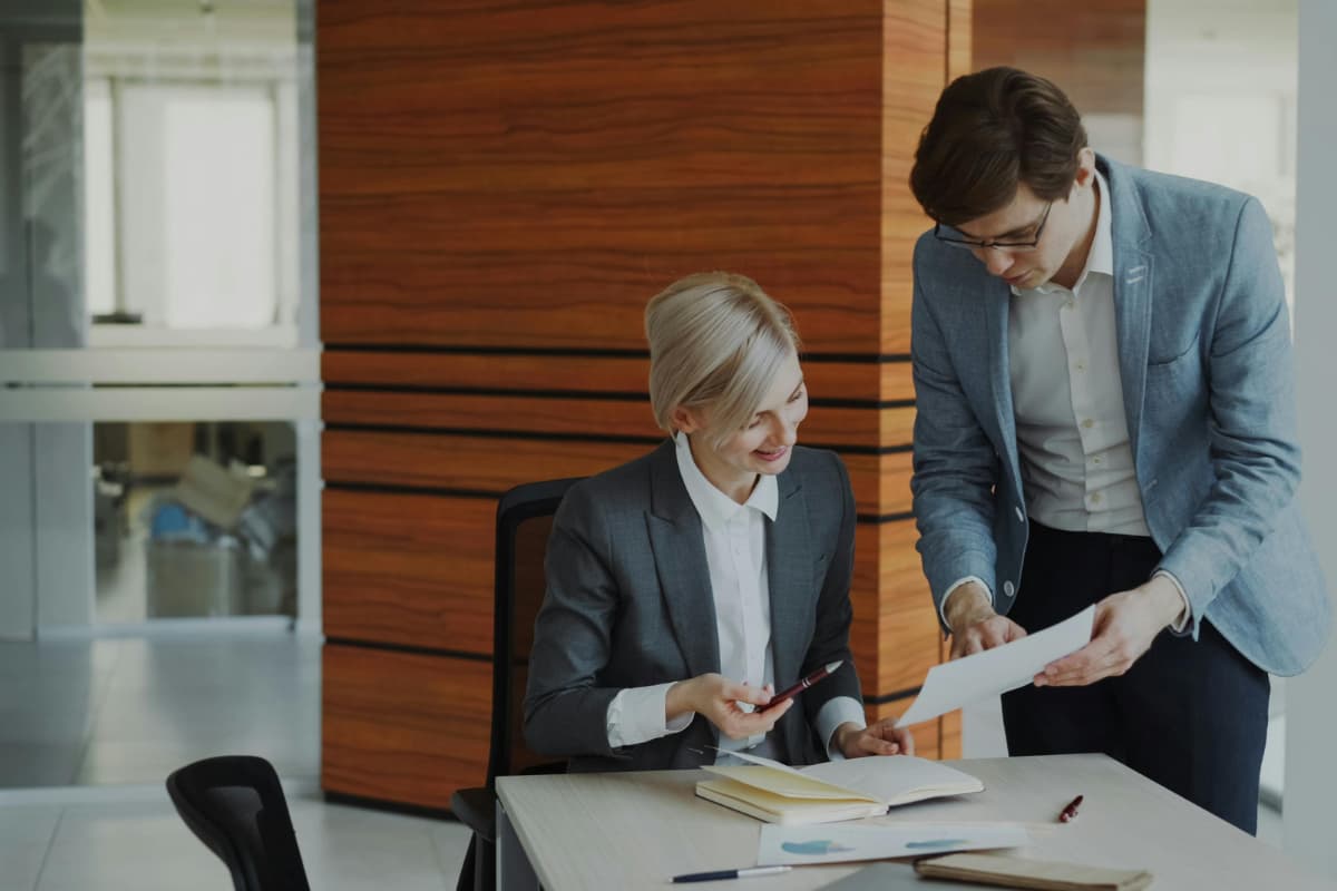 Business professionals looking at cloud services options