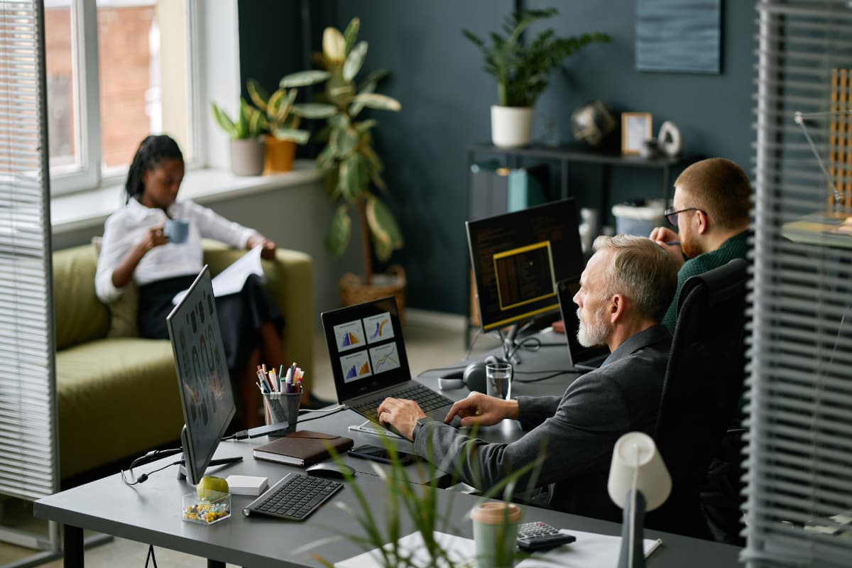 Pittsburgh non-profit working at desks using PCC cybersecurity solutions