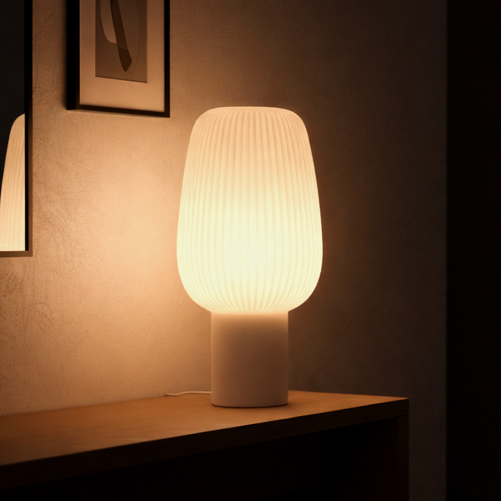 Glowing ribbed lamp on a wooden console.
