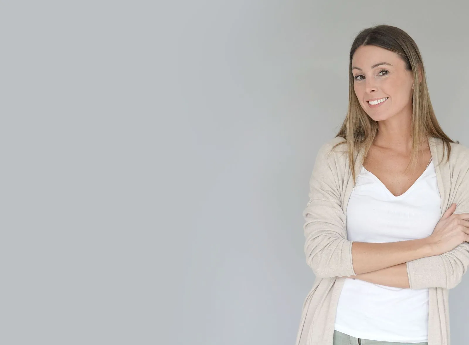 A woman standing with her arms crossed.