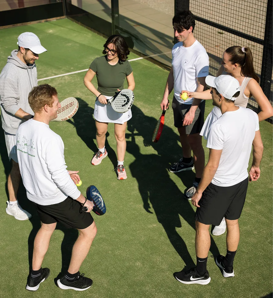 A group of people on a padel court