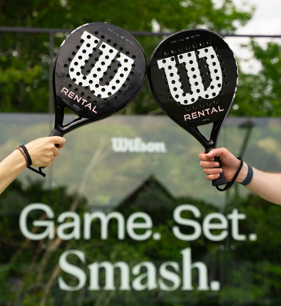 A man and a woman on a padel court