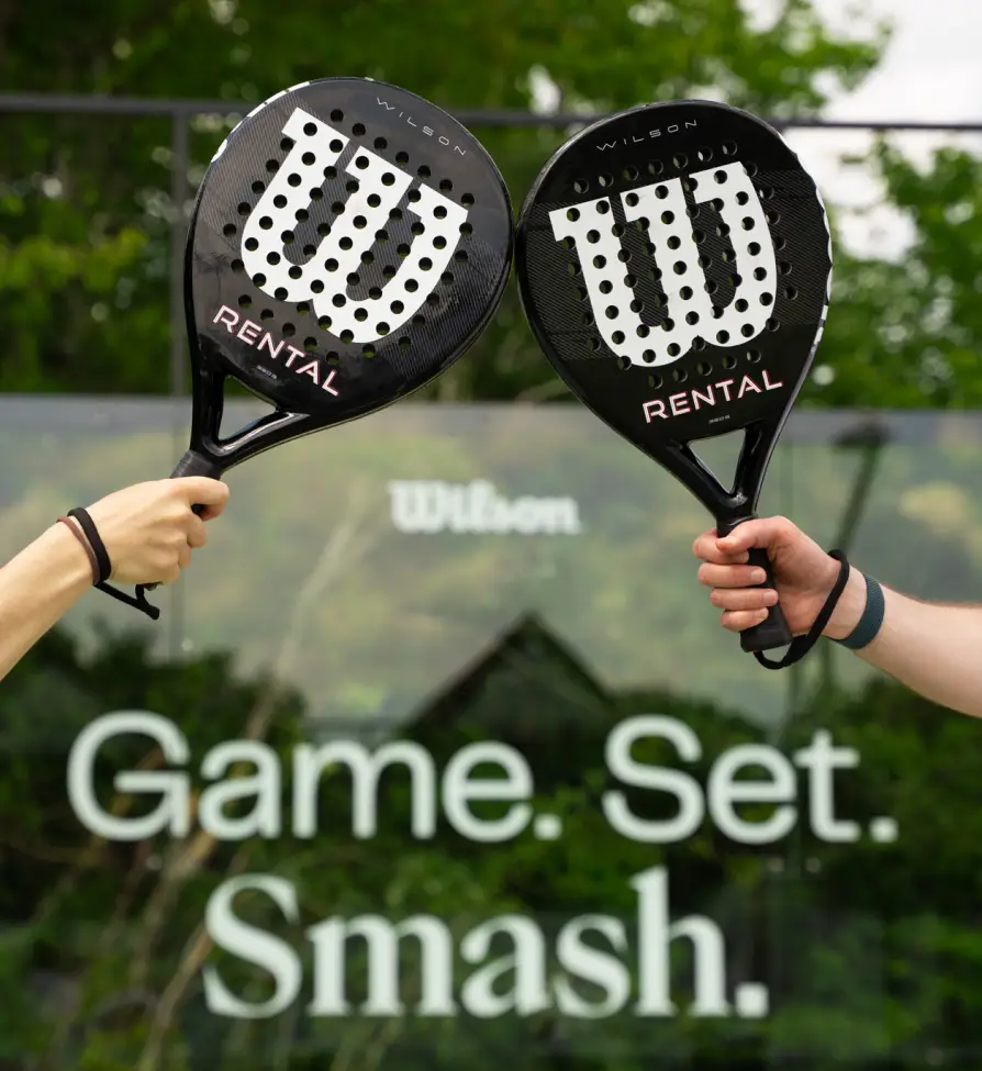 A man and a woman on a padel court