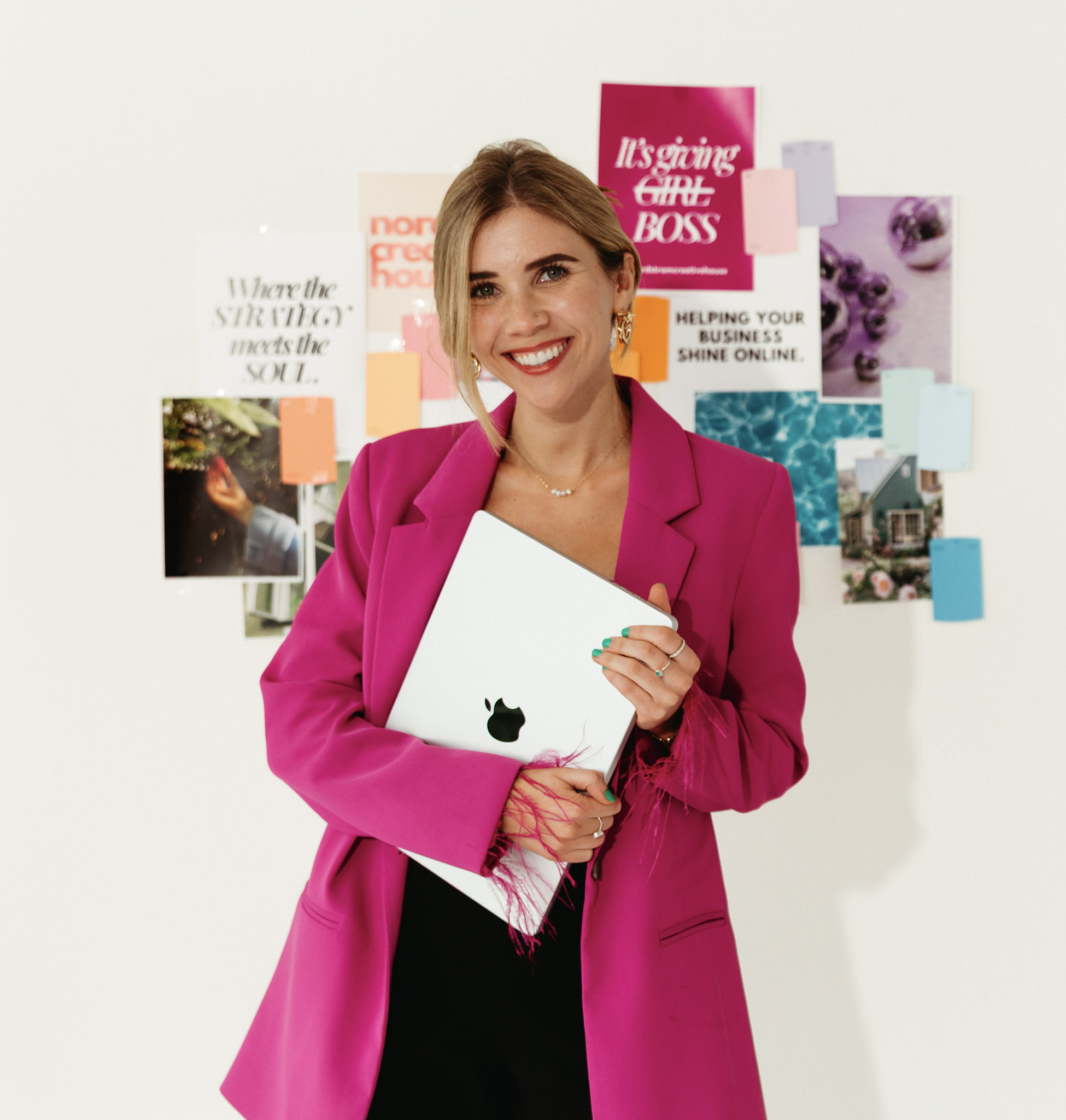 Nicole Nordstrom in a green blazer meeting with a client at a laptop, smiling during a strategy discussion
