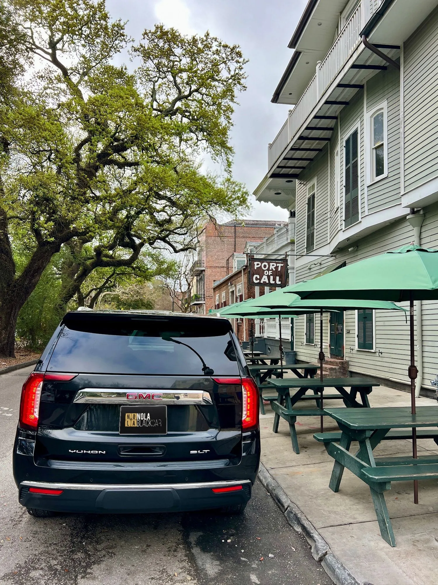 Rear view of a black SUV parked on a New Orleans street