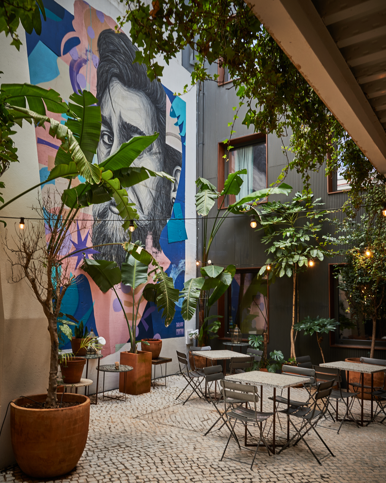 Lush private patio garden with tropical plants at Secret Patio Lisbon boutique hotel