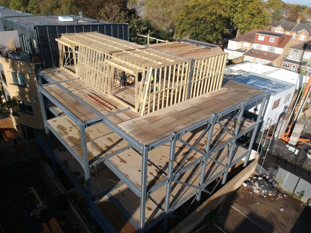 CONSTRUCTION PROGRESS | Timber elements are introduced, adding form and texture as the building takes shape.