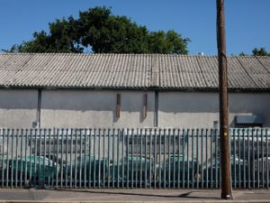 BEFORE REDEVELOPMENT | Exterior of the site in its original state, where outdated materials required substantial upgrades.
