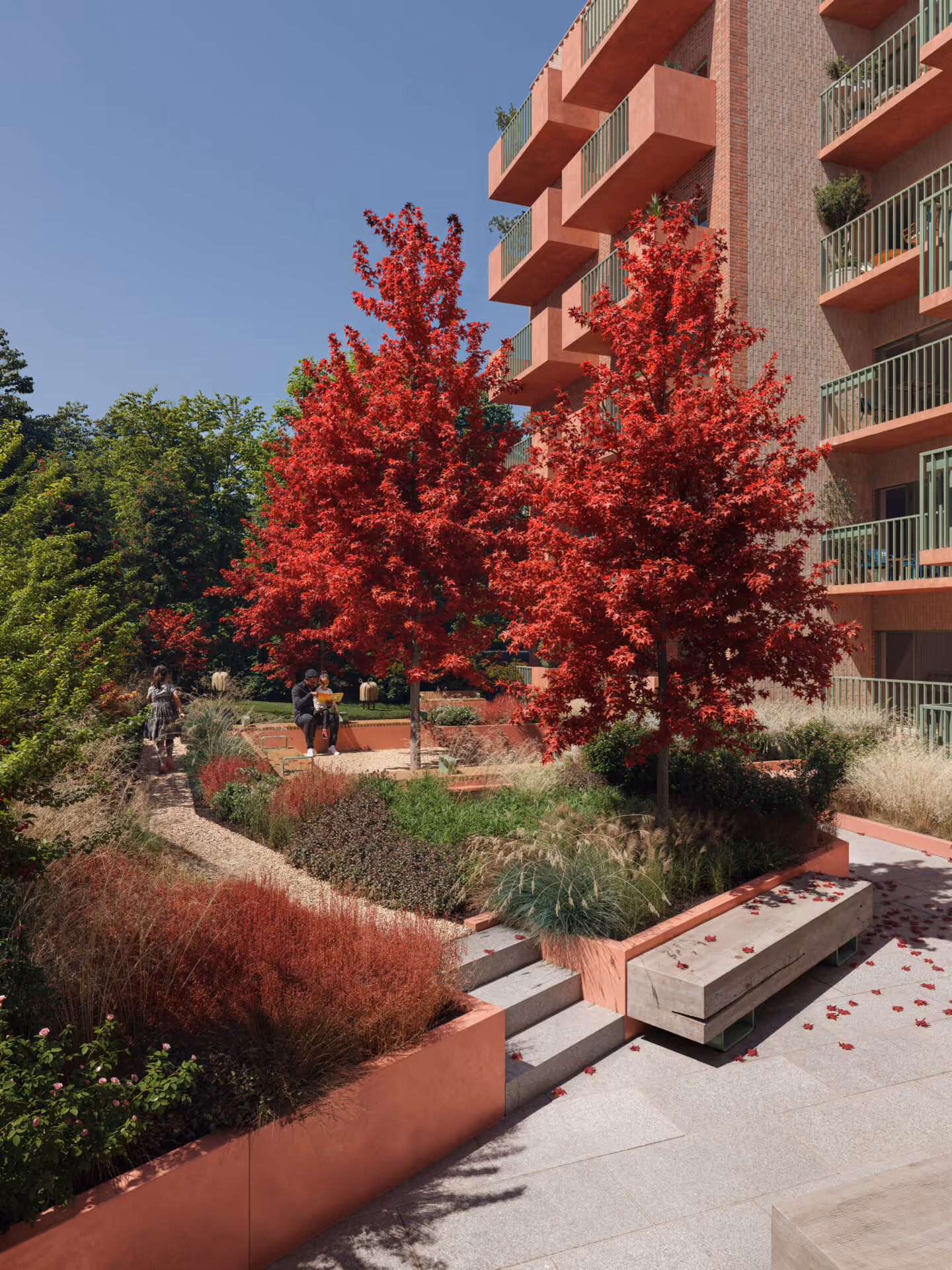 COMMUNITY-FOCUSED DESIGN | Shared courtyard space framed by contemporary brick façades, encouraging interaction and connection.