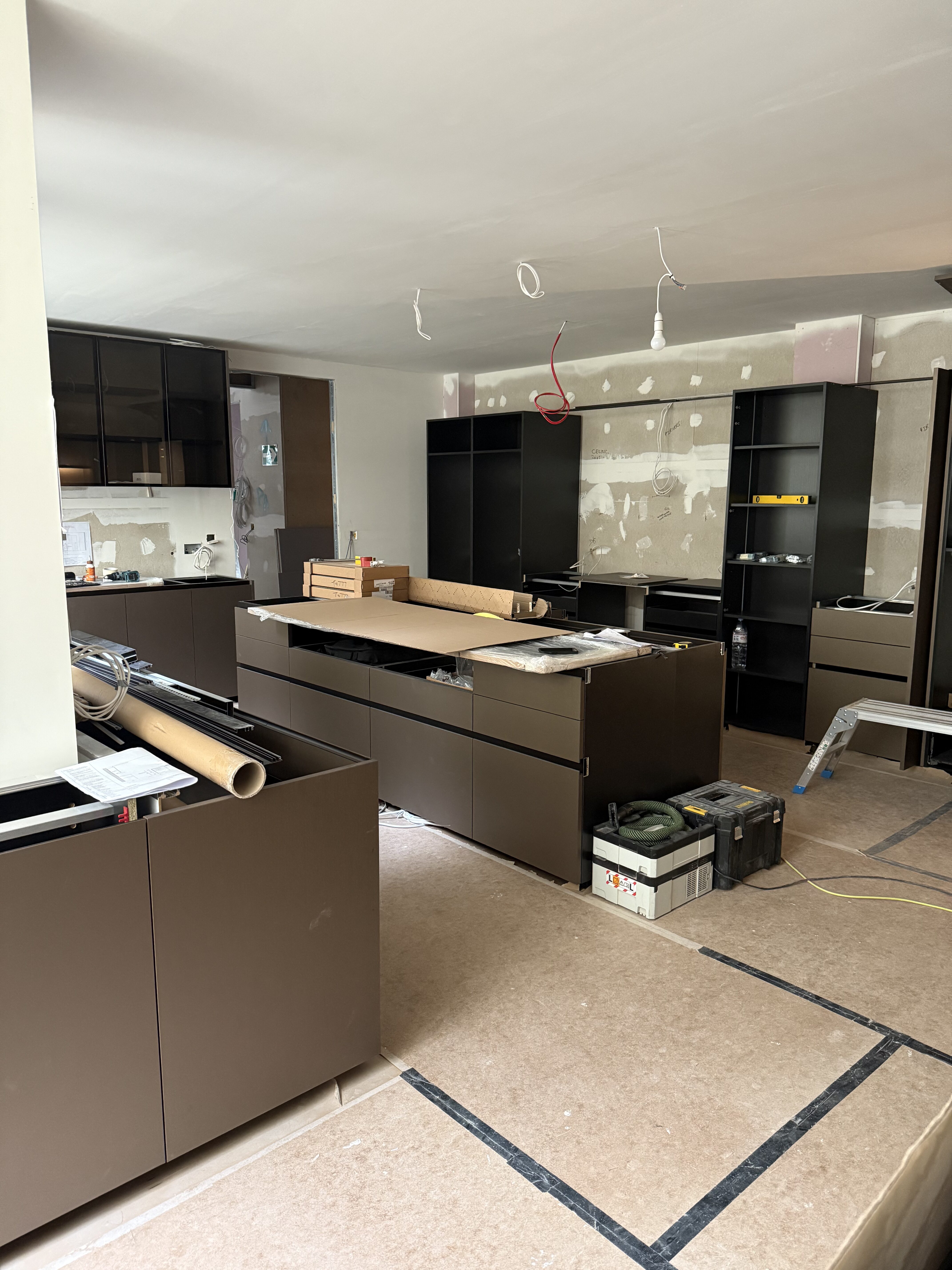 INSTALLATION IN MOTION | Cabinetry and joinery define the emerging kitchen space.