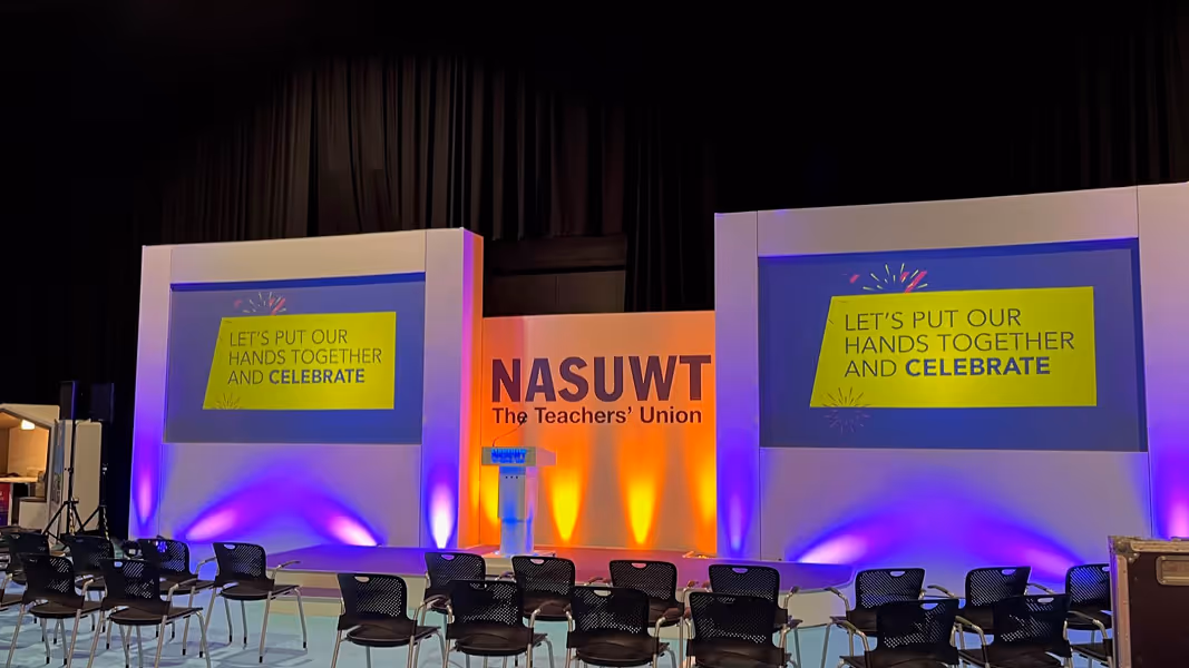 Exhibition hall with a large archway displaying 'Drug Discovery' and booths in the background.