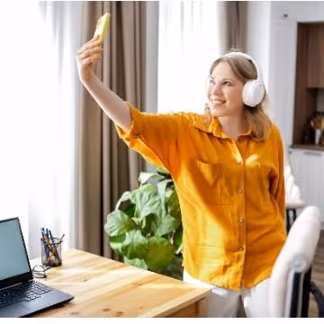 Female marketer taking a selfie in her office