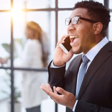 Man laughing on phone