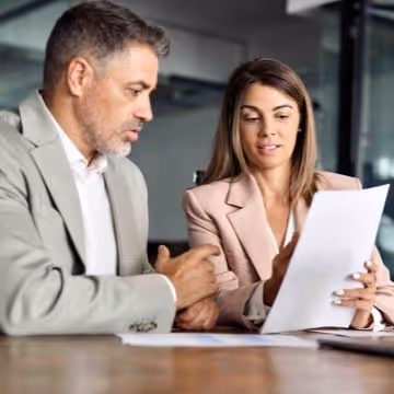 Man and woman looking at cv