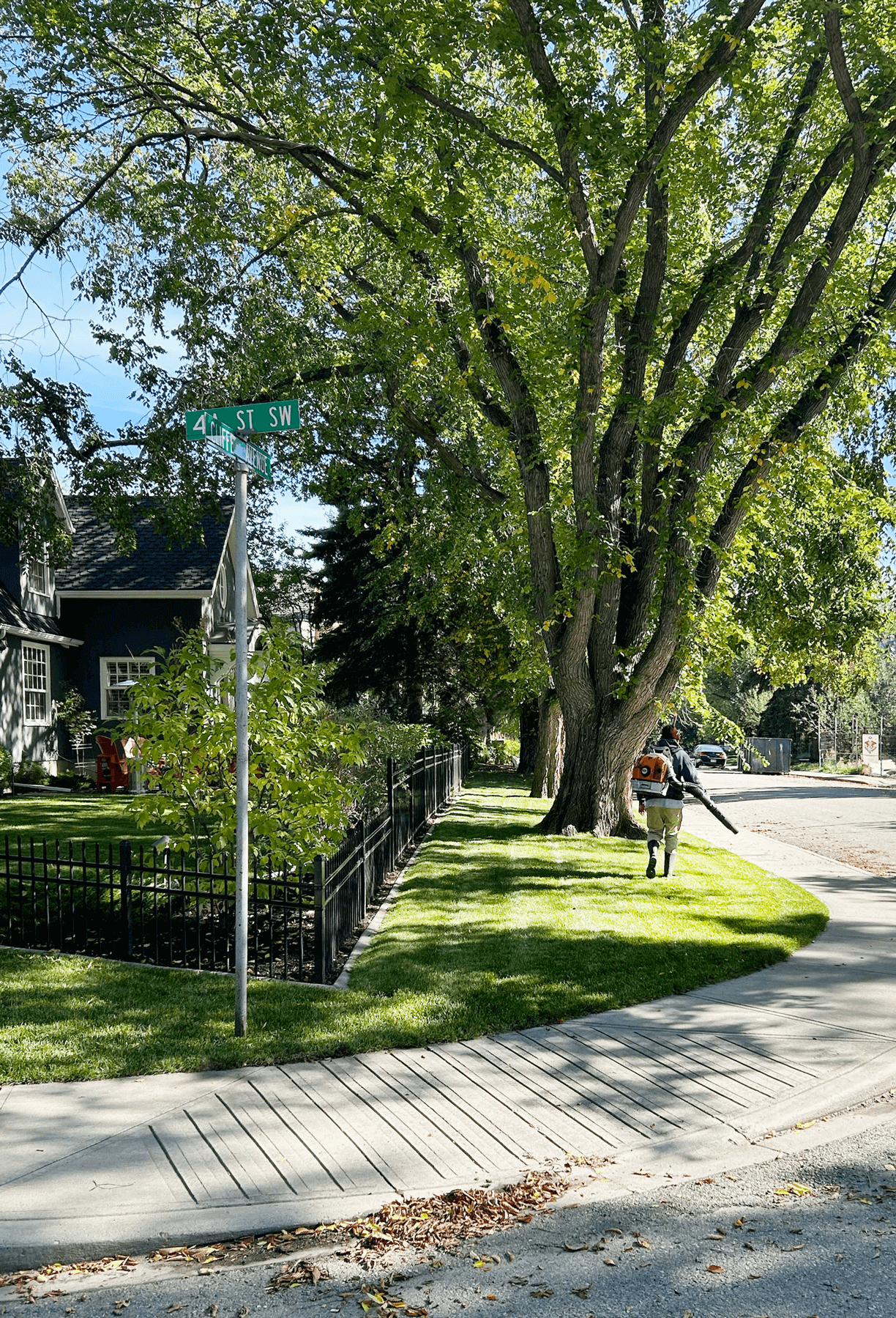 An Elite Yards Landscaping worker works to clear debris in Calgary, Alberta.